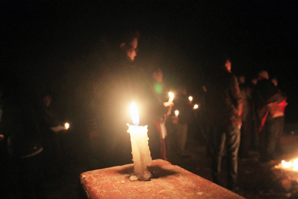 A candle stick lights up as people come in solidarity in memorial of late Bendangnungsang Longkumer, late Khriesavizo Metha, and late Tsapise Sangtam during the candlelight service held on February 9. (Morung Photo)